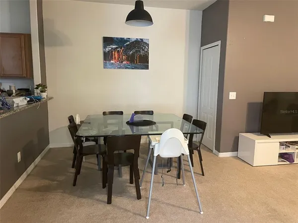 a view of a dining room with furniture