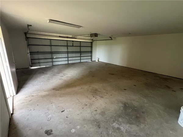 an empty room with wooden floor