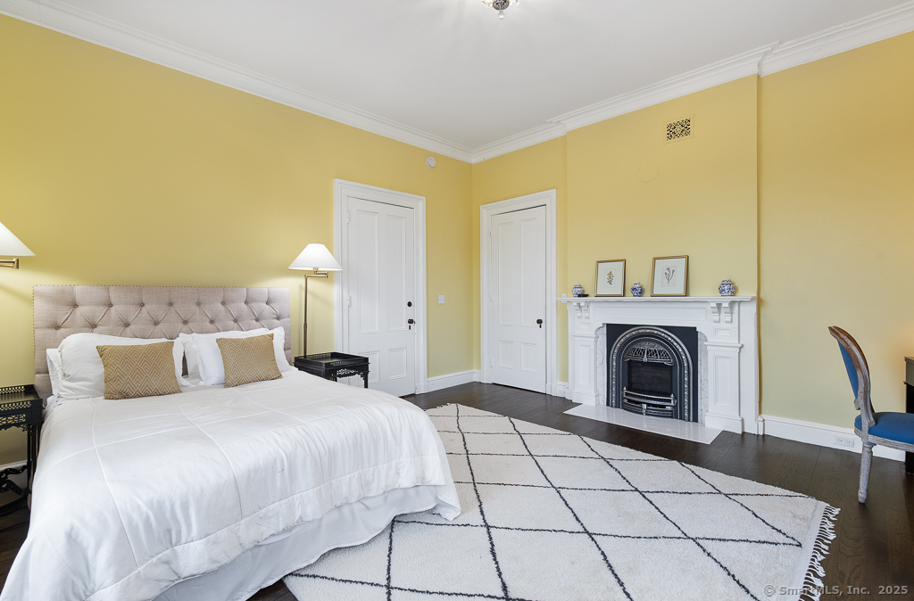 114 Walkley Hill Road Haddam, CT 06438 - Photo 23 of 28 a bedroom with a bed and a fireplace