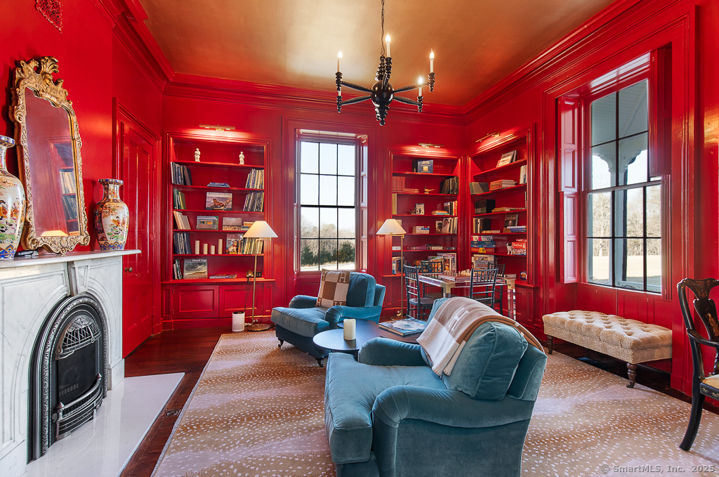 114 Walkley Hill Road Haddam, CT 06438 - Photo 8 of 28 a living room with furniture a fireplace and lots of windows