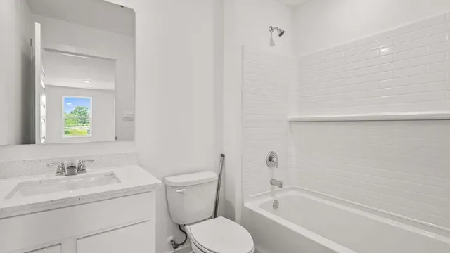 a bathroom with a sink toilet and vanity