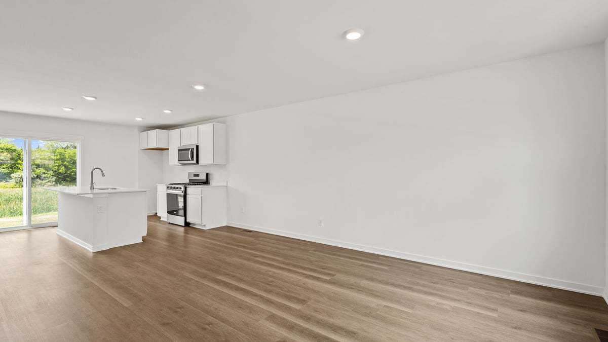 602 Adirondack Court Joliet, IL 60421 - Photo 7 of 16 a view of kitchen with white cabinets and wooden floor