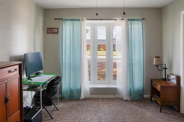 a bedroom with a bed and a table in it