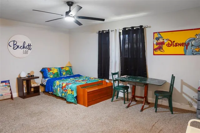 a view of a hallway with closet and a bathroom