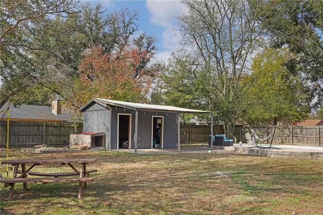 a view of a yard with swimming pool
