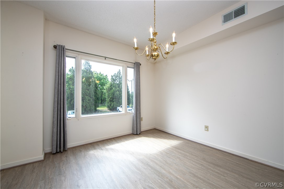 301 Beacon Ridge Drive, Unit 209 Hopewell, VA 23860 - Photo 11 of 36 Light filled dining area with lots of wall space f
