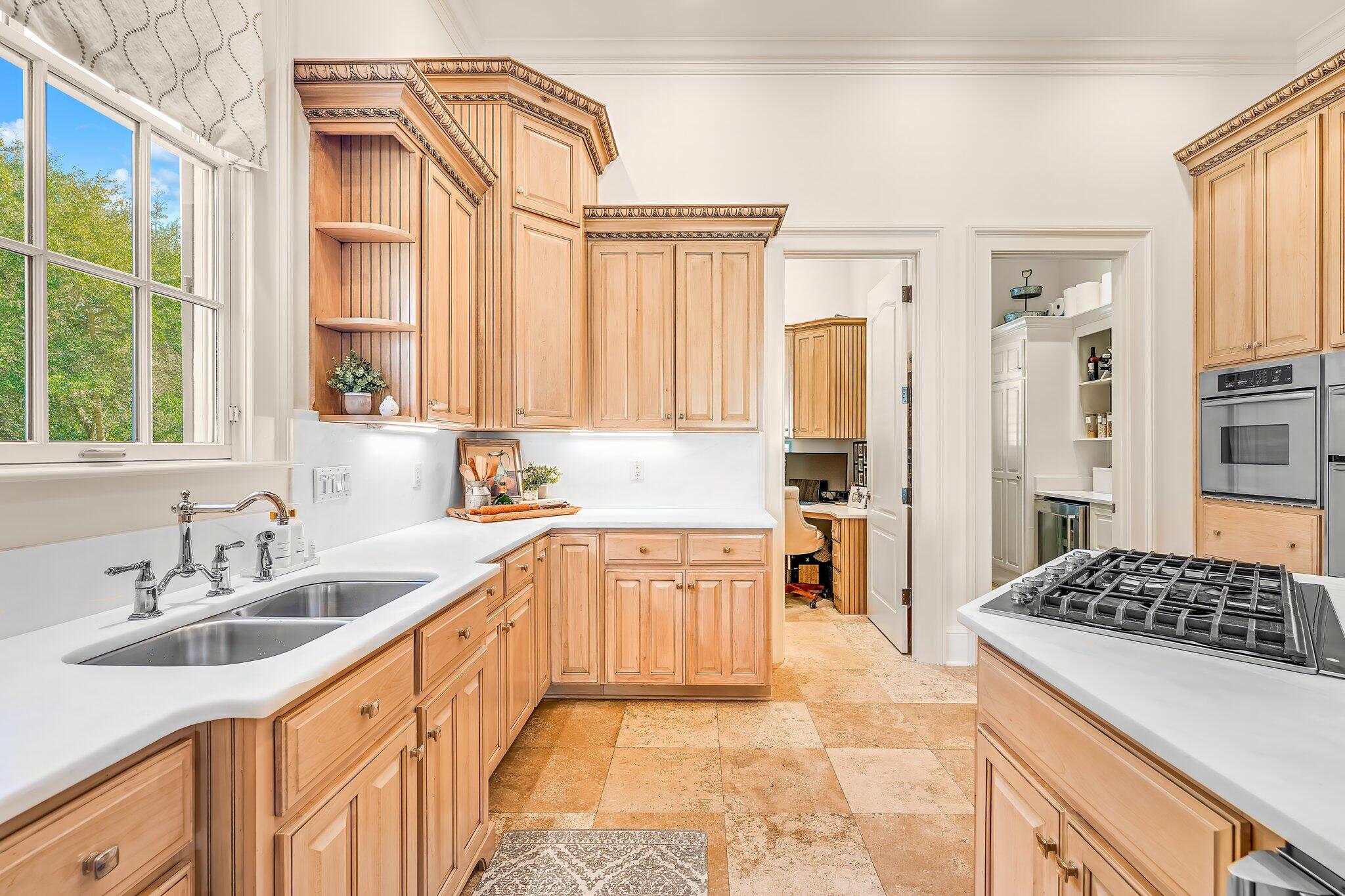 286 Rue Caribe Miramar Beach, FL 32550 - Photo 19 of 79 a kitchen with stainless steel appliances granite countertop a sink stove and refrigerator