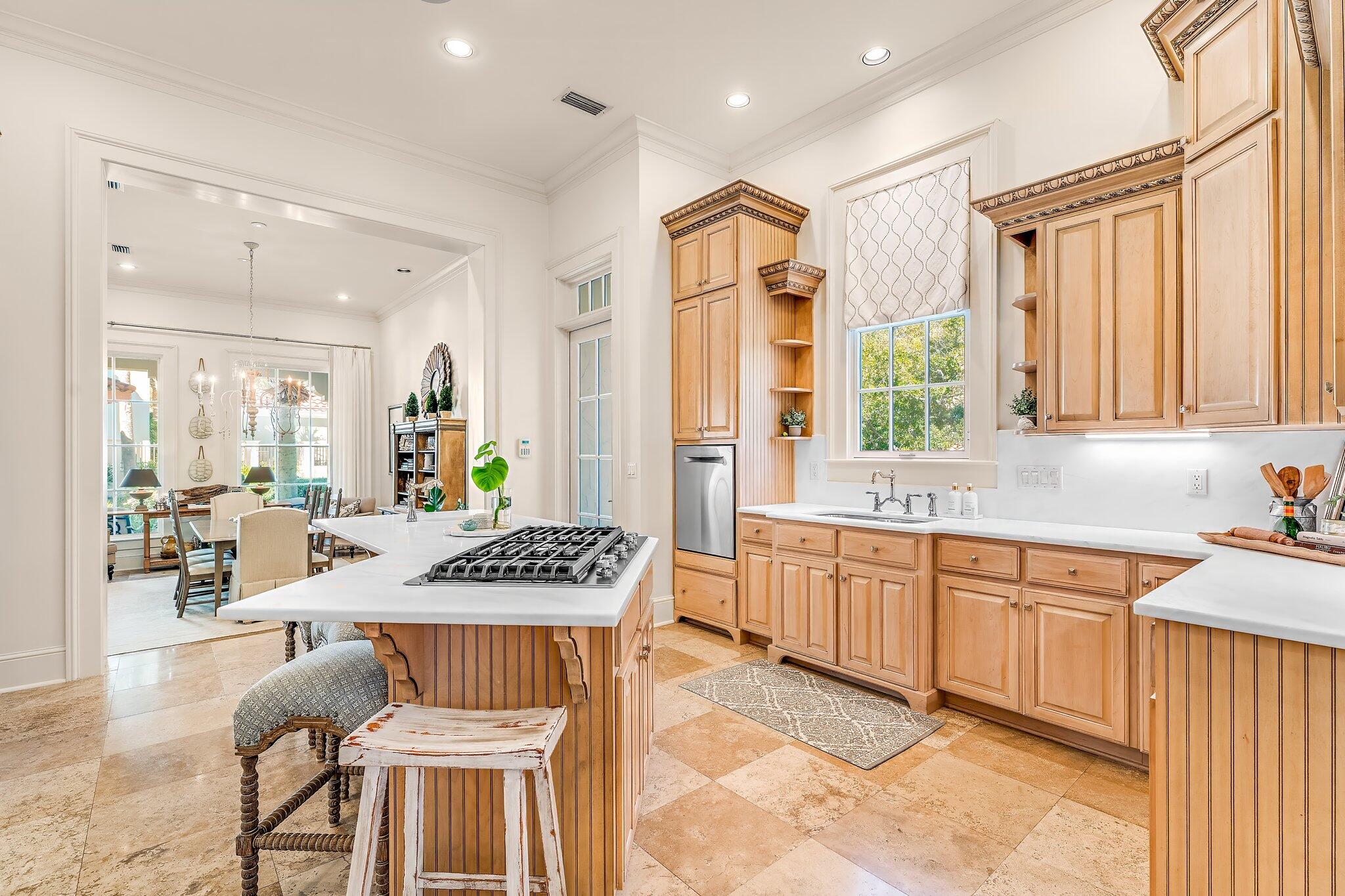 286 Rue Caribe Miramar Beach, FL 32550 - Photo 20 of 79 a kitchen with stainless steel appliances granite countertop a stove a sink dishwasher and cabinets with wooden floor