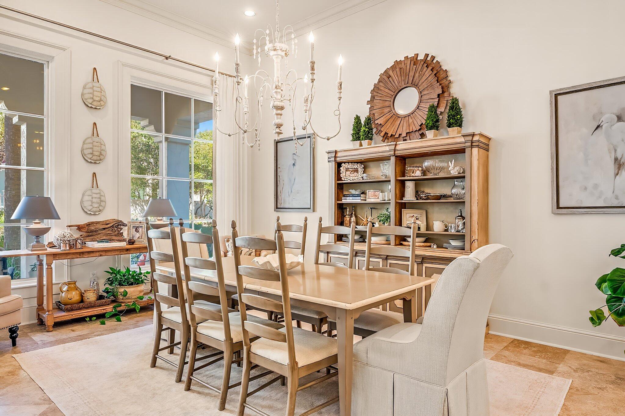 286 Rue Caribe Miramar Beach, FL 32550 - Photo 30 of 79 a view of a dining room with furniture and a chandelier