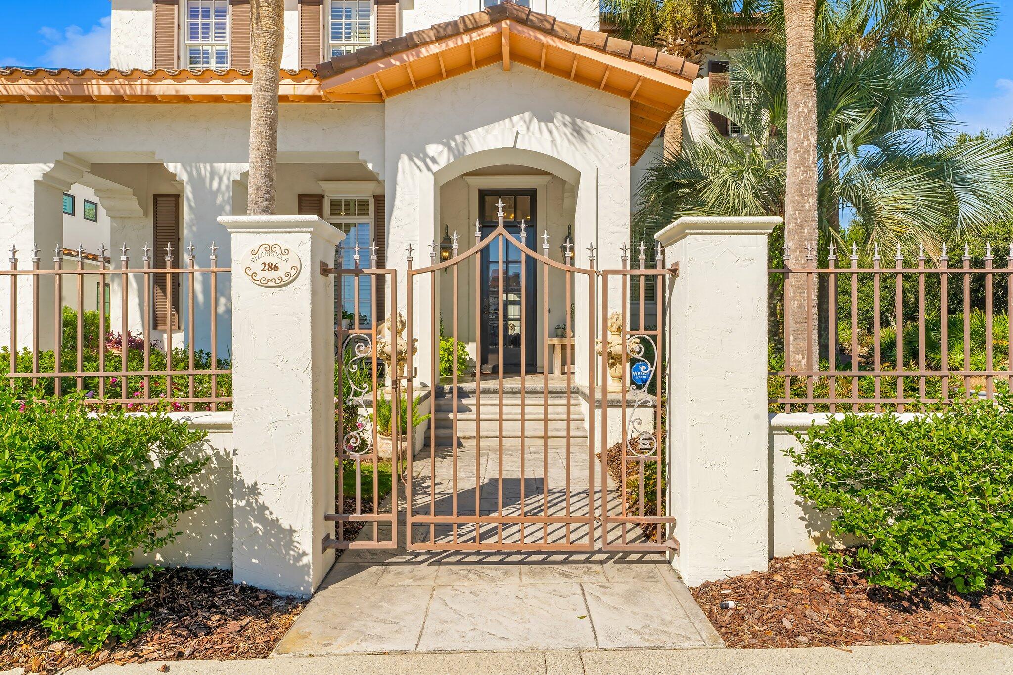 286 Rue Caribe Miramar Beach, FL 32550 - Photo 3 of 79 a front view of a house with a glass windows