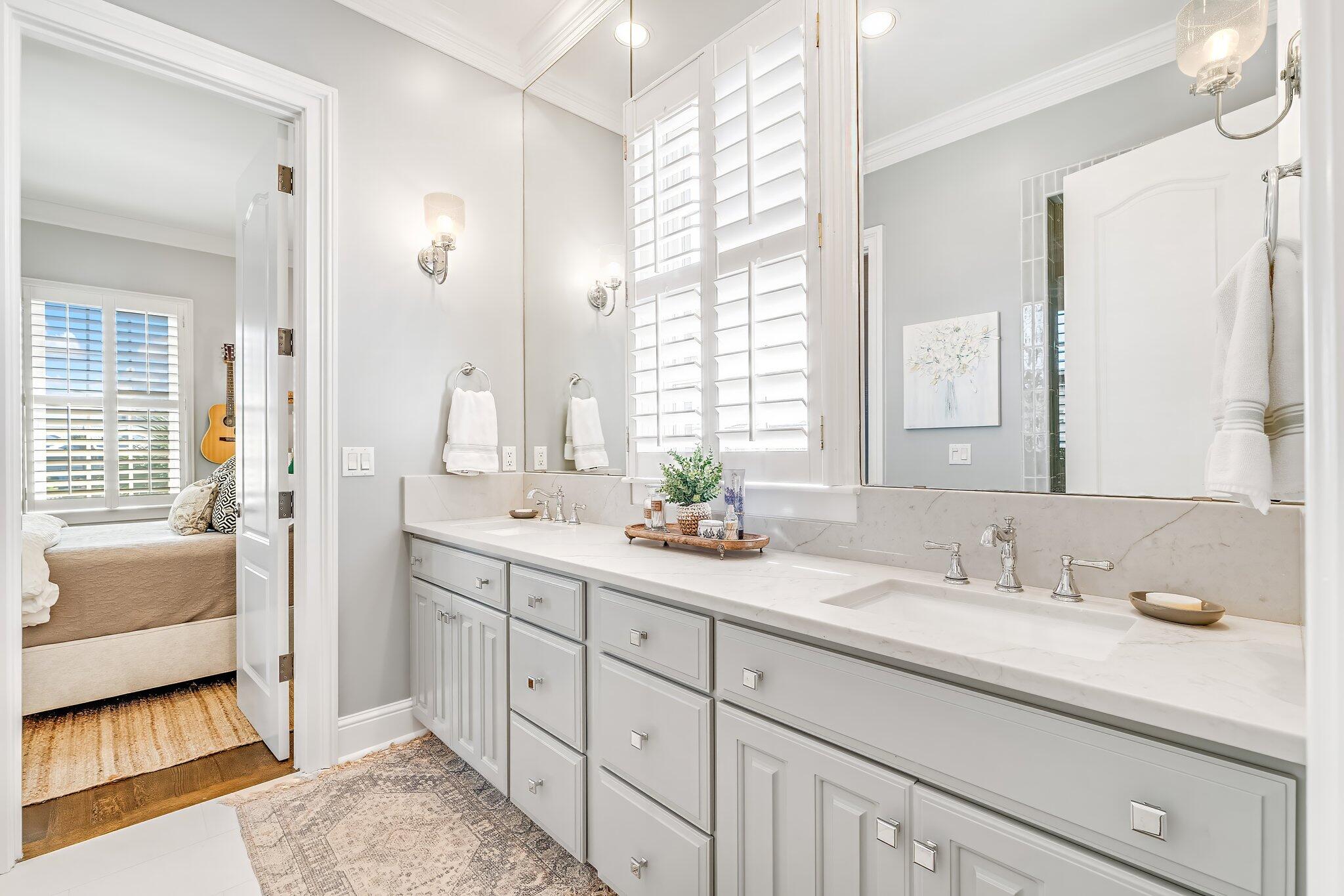 286 Rue Caribe Miramar Beach, FL 32550 - Photo 38 of 79 a bathroom with double vanity sinks a large mirror and a bathtub