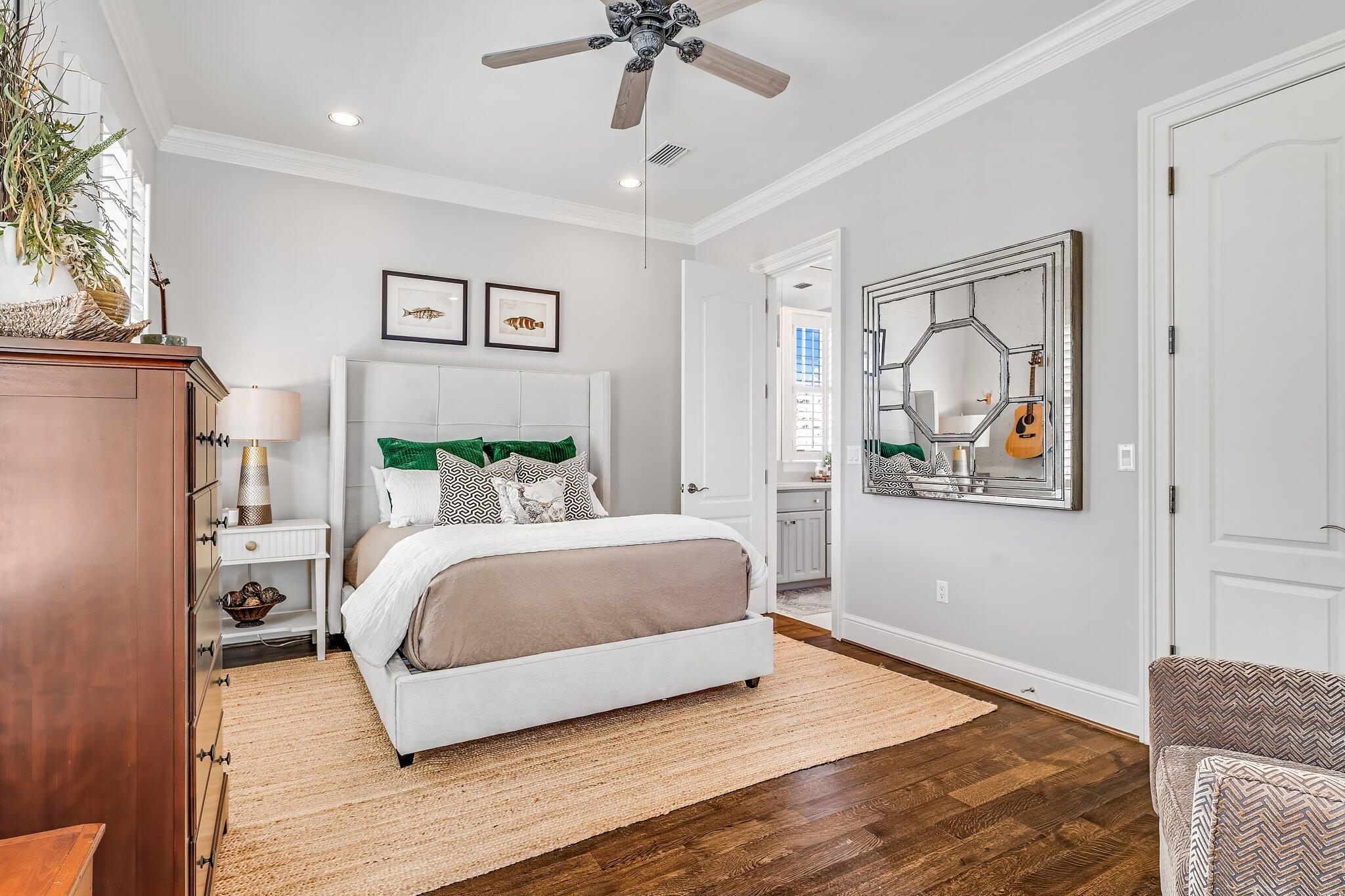 286 Rue Caribe Miramar Beach, FL 32550 - Photo 40 of 79 a spacious bedroom with a bed and a chandelier