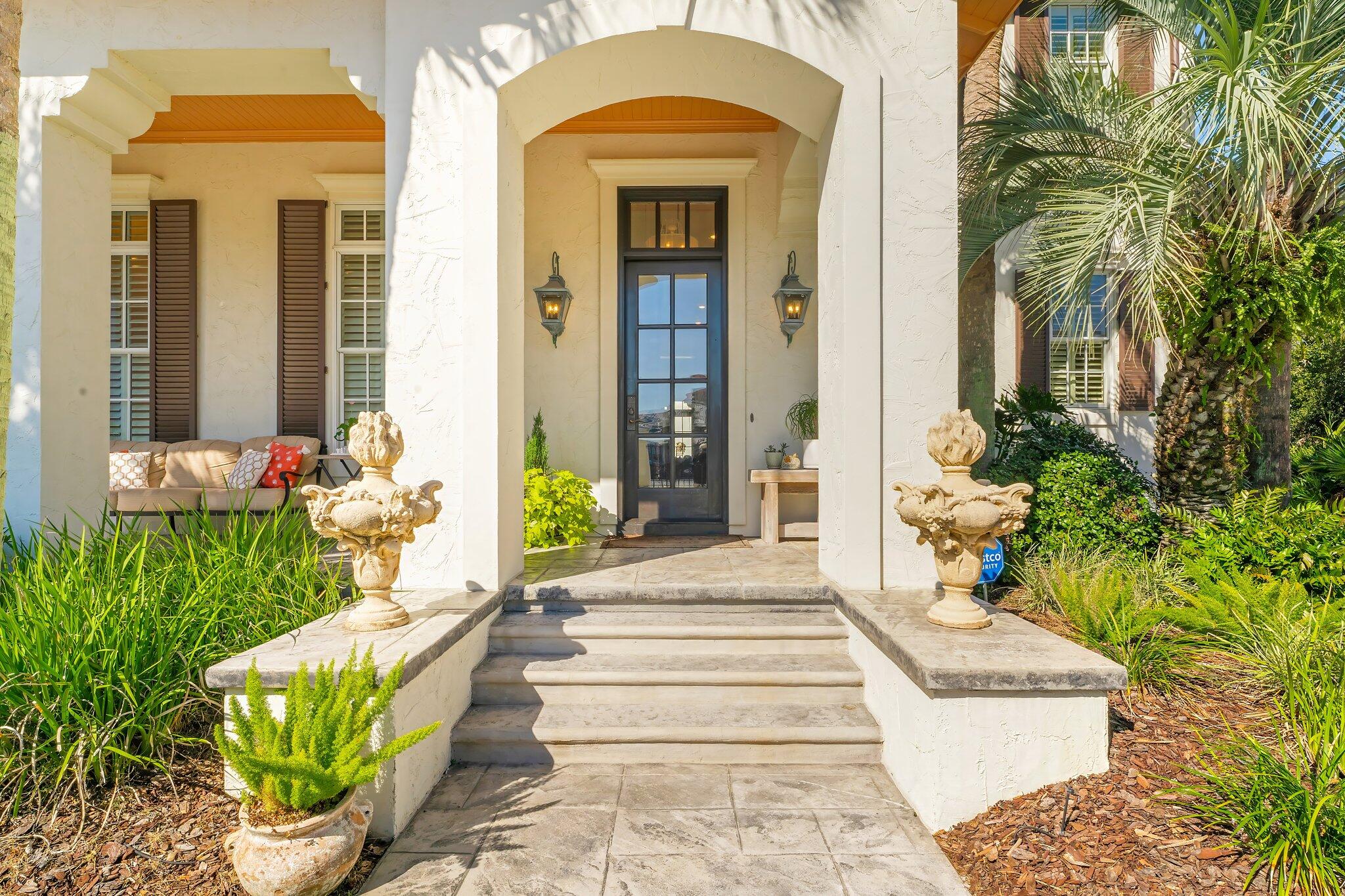286 Rue Caribe Miramar Beach, FL 32550 - Photo 4 of 79 a front view of a house with a garden