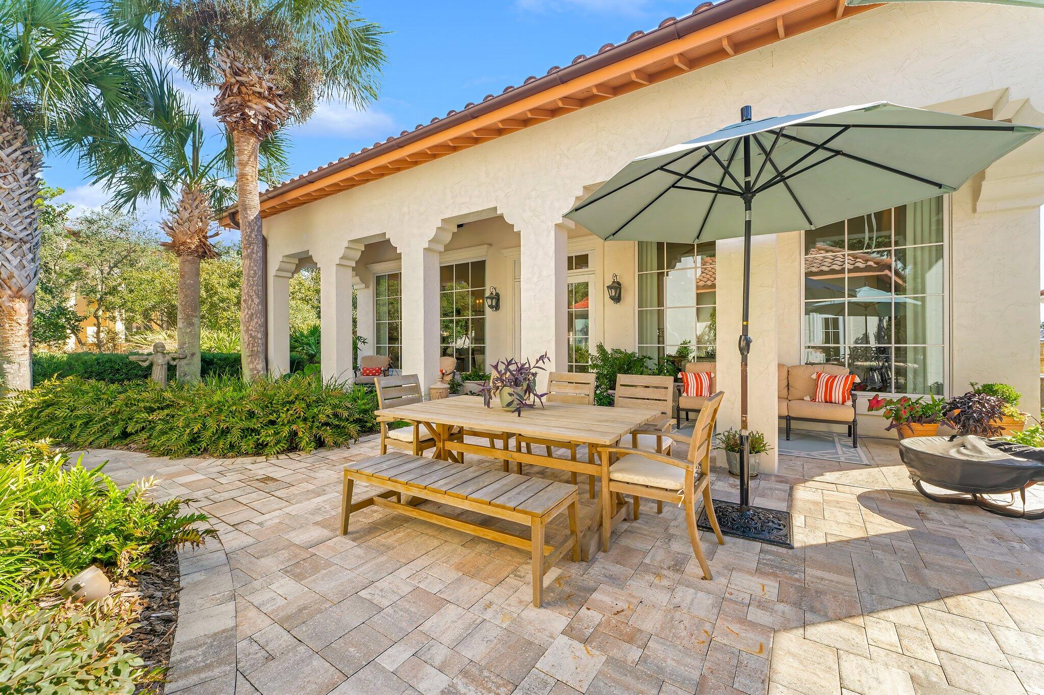 286 Rue Caribe Miramar Beach, FL 32550 - Photo 51 of 79 a view of patio with a table and chairs under an umbrella
