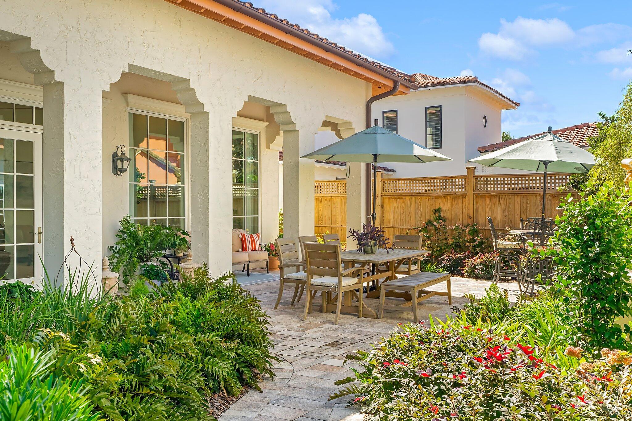 286 Rue Caribe Miramar Beach, FL 32550 - Photo 53 of 79 a view of a patio with couches table and chairs and potted plants
