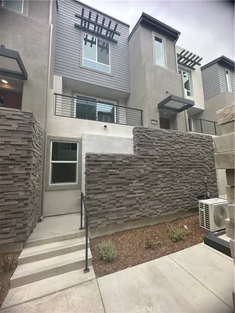 a front view of a house with stairs
