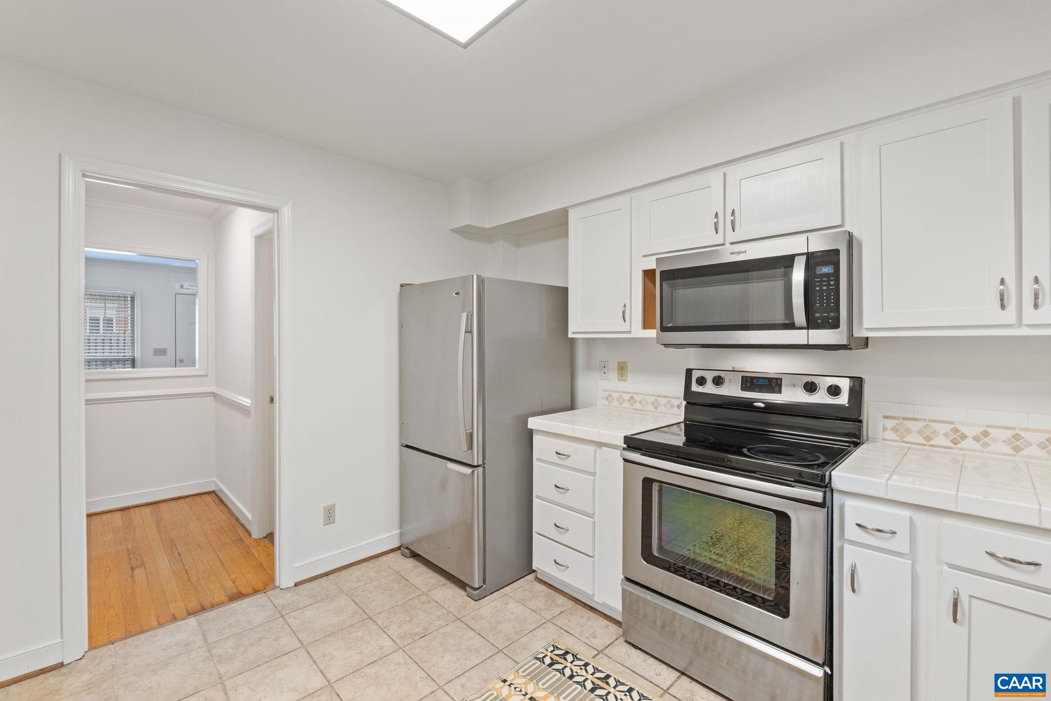 2752 Hydraulic Road Charlottesville, VA 22901 - Photo 13 of 41 a kitchen with a refrigerator stove and microwave