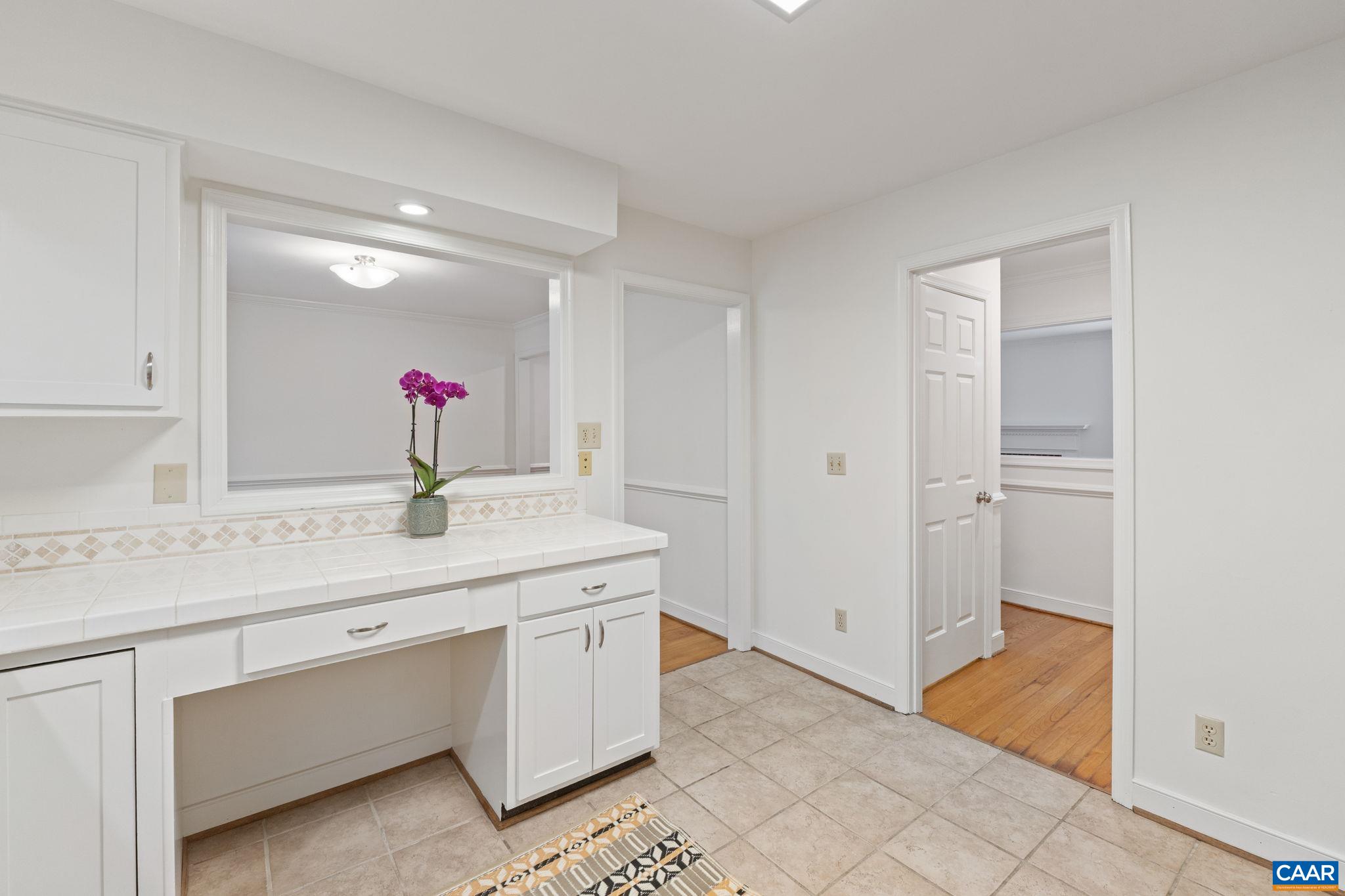 2752 Hydraulic Road Charlottesville, VA 22901 - Photo 14 of 41 a bathroom with a sink and a mirror