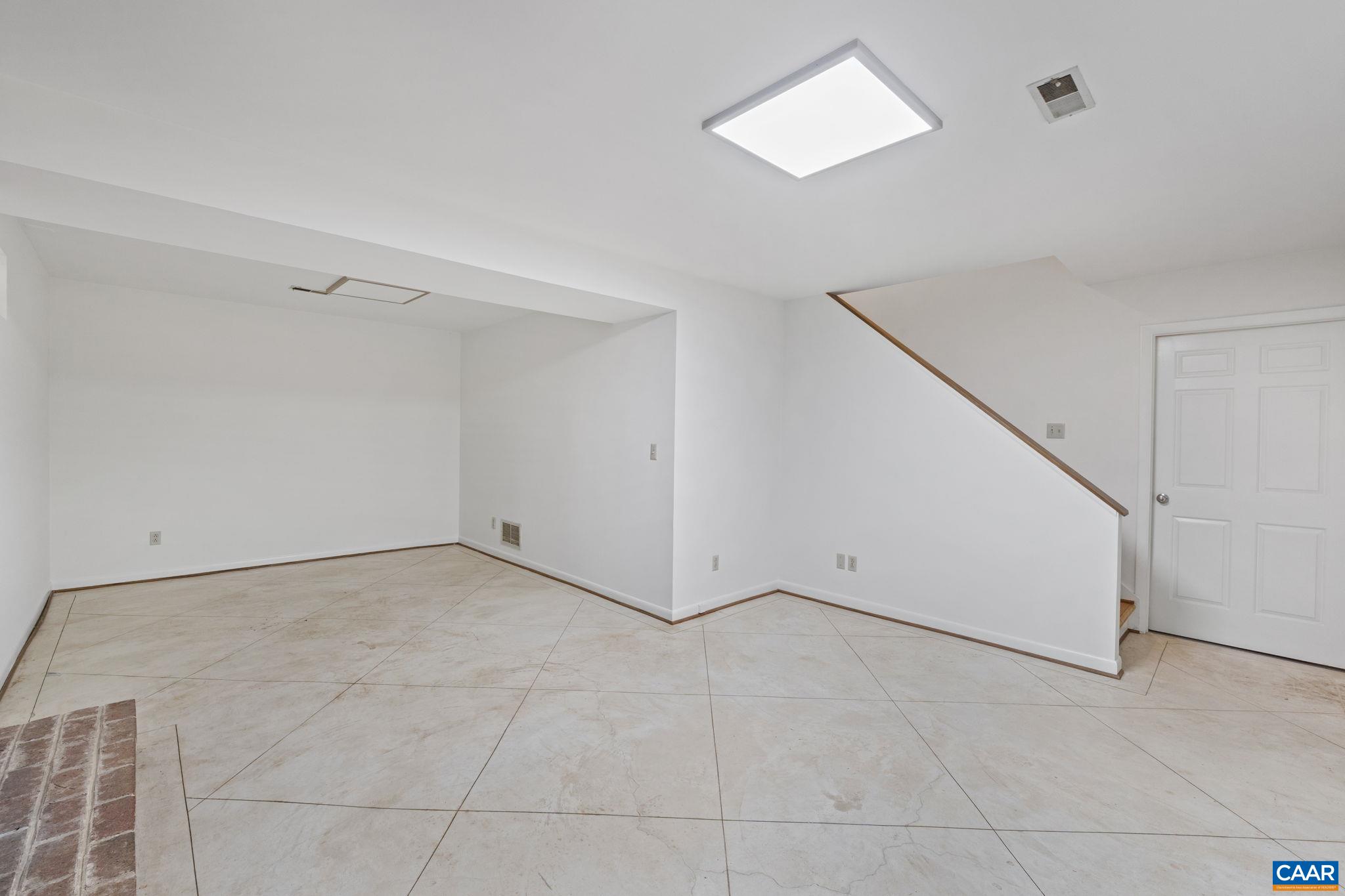 2752 Hydraulic Road Charlottesville, VA 22901 - Photo 29 of 41 a view of an empty room with a ceiling fan
