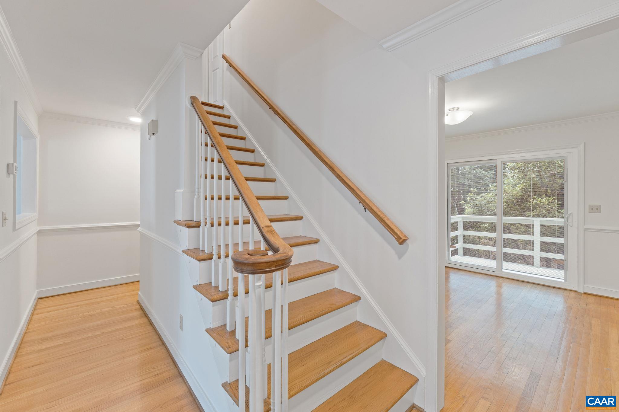 2752 Hydraulic Road Charlottesville, VA 22901 - Photo 10 of 41 a view of entryway with wooden floor and stairs