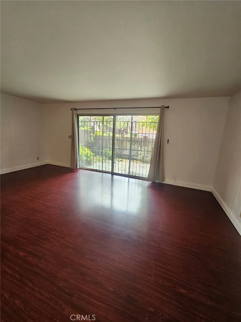 75 Western Shore Lane, Unit 1 San Francisco, CA 94102 - Photo 13 of 17 a view of an empty room with wooden floor and a window