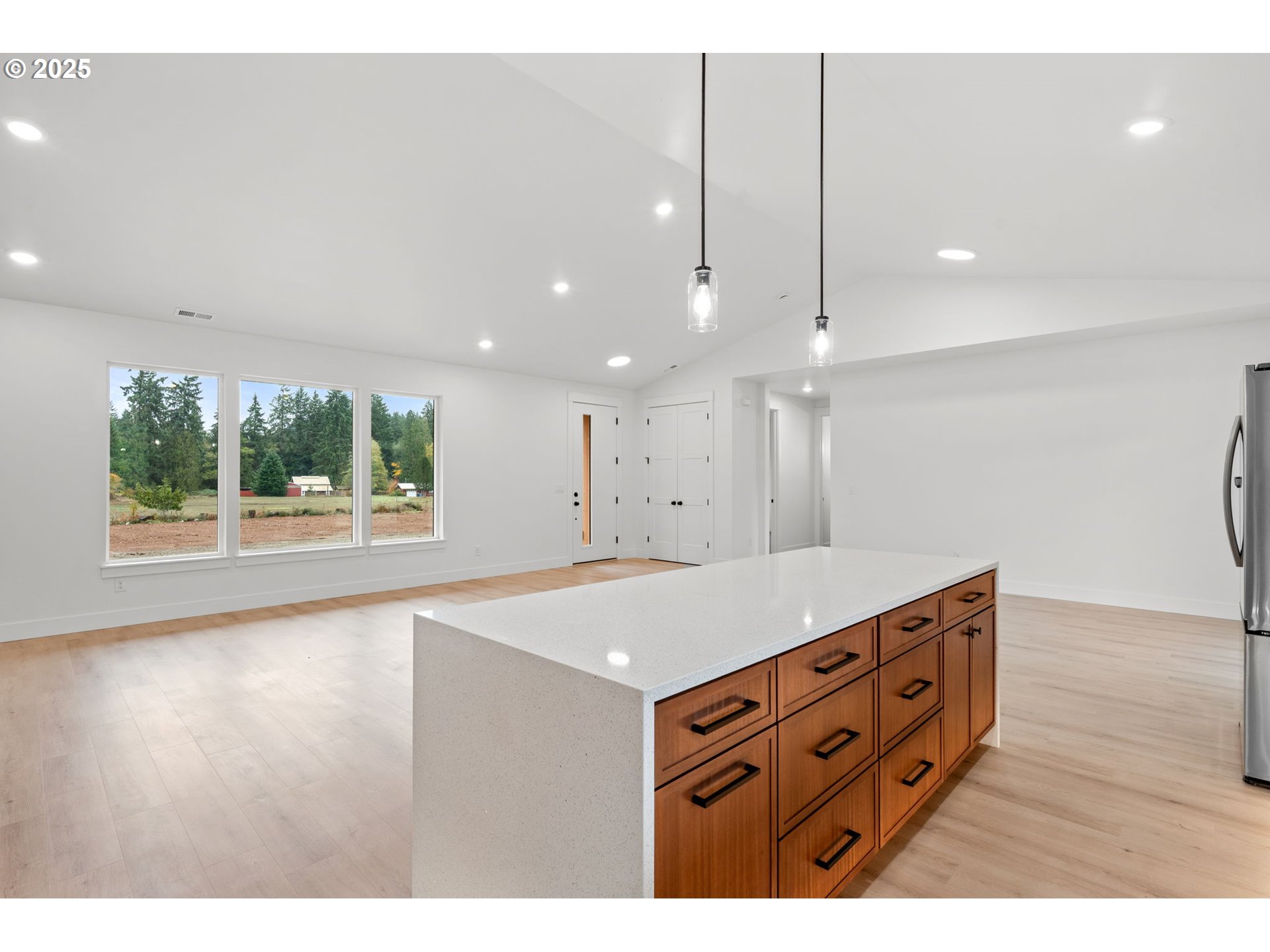 148 Fries Road Winlock, WA 98596 - Photo 11 of 39 a open kitchen with a sink a large window and wooden floor