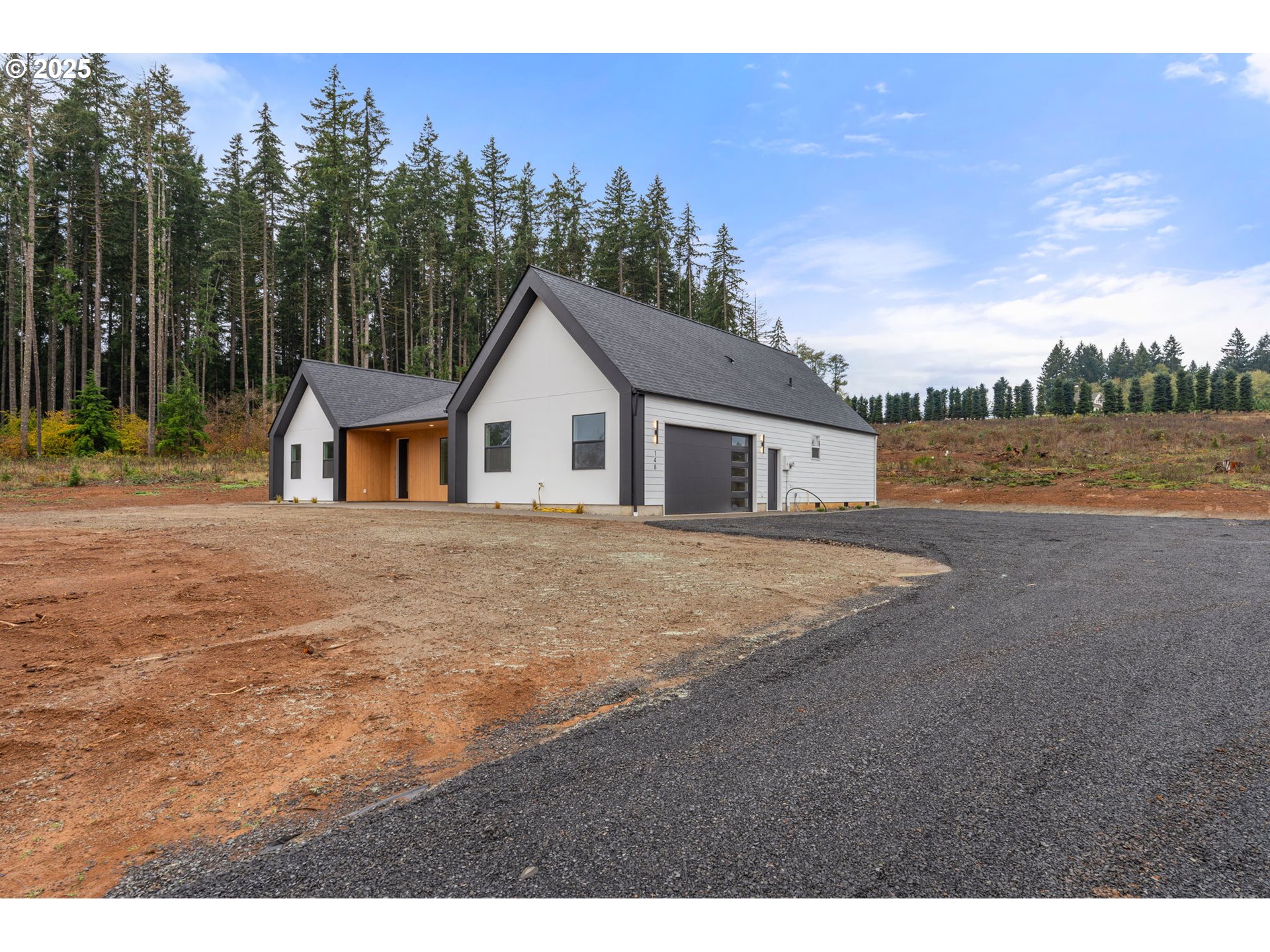 148 Fries Road Winlock, WA 98596 - Photo 2 of 39 a view of an house with backyard and outdoor space