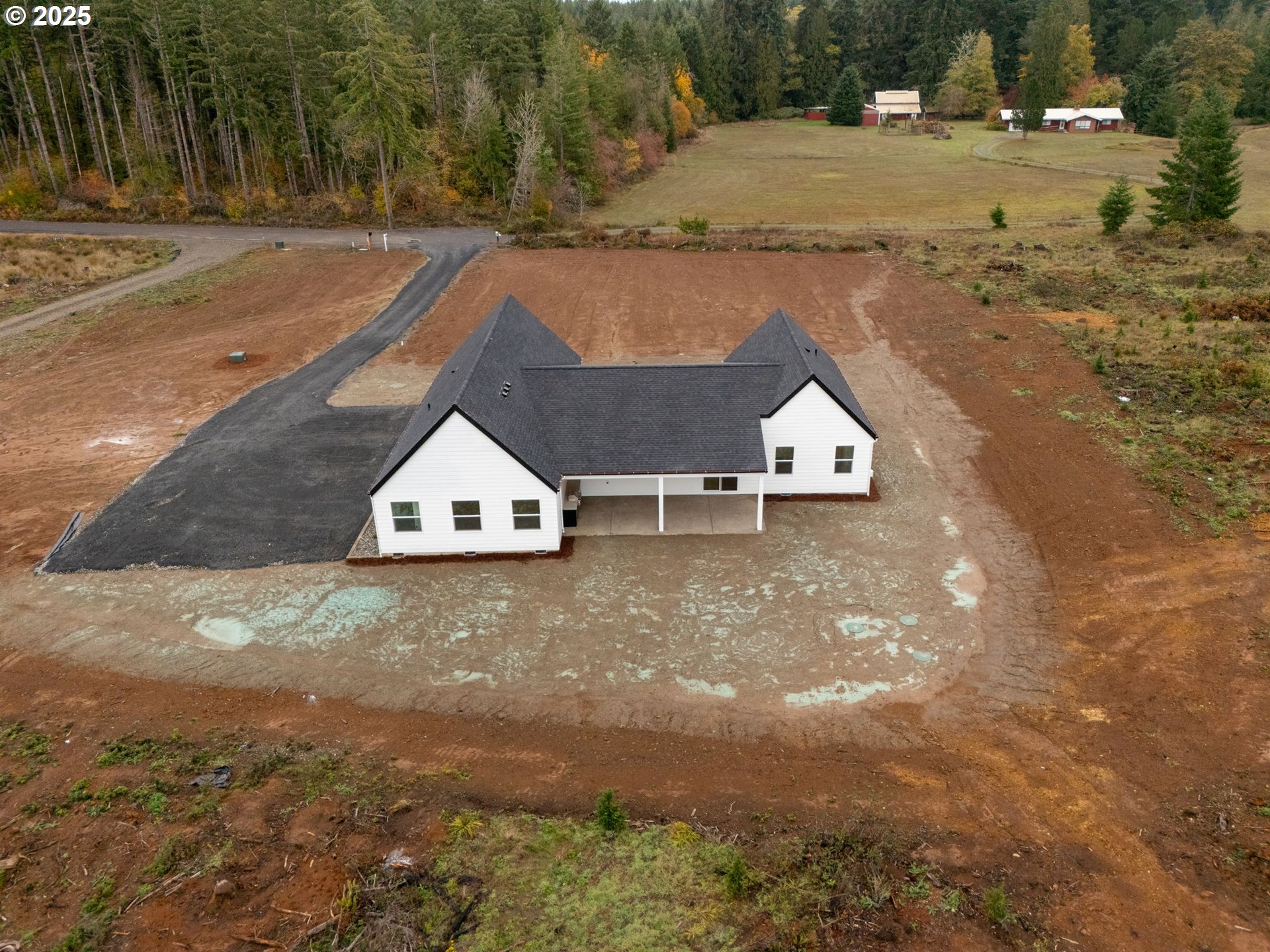 148 Fries Road Winlock, WA 98596 - Photo 35 of 39 a view of a house with a yard and large trees
