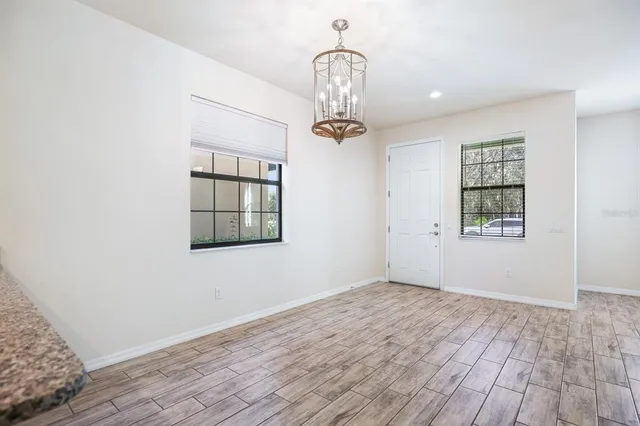 a view of swimming pool with outdoor seating and plants