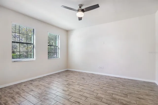a backyard of a house with a yard and outdoor seating