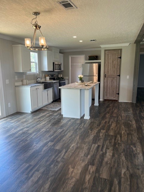 54207 Marlee Road Callahan, FL 32011 - Photo 2 of 8 a large kitchen with a lot of counter space and wooden floor