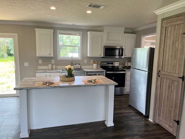 54207 Marlee Road Callahan, FL 32011 - Photo 3 of 8 a kitchen with a sink a refrigerator a stove and a window