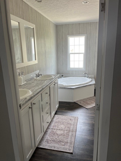 54207 Marlee Road Callahan, FL 32011 - Photo 8 of 8 a bathroom with a double vanity sink a mirror and a bathtub