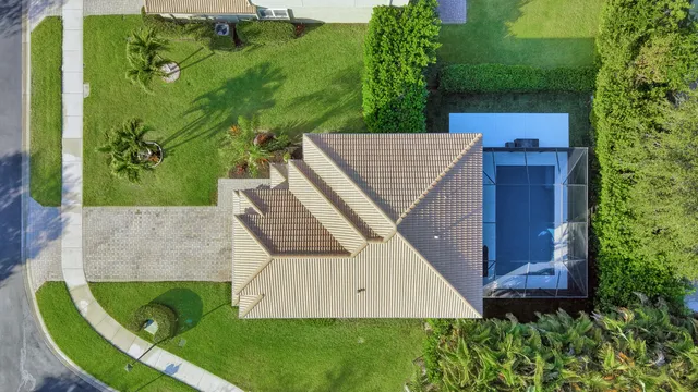 a kitchen with stainless steel appliances kitchen island granite countertop a dining table chairs and granite counter tops