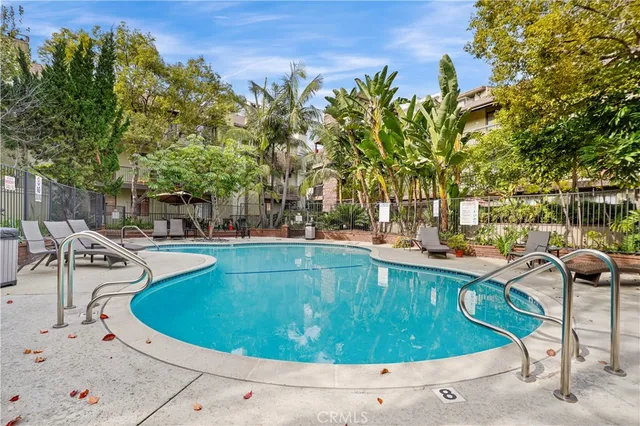 a view of a swimming pool with a patio
