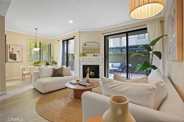 a living room with furniture wooden floor and a flat screen tv