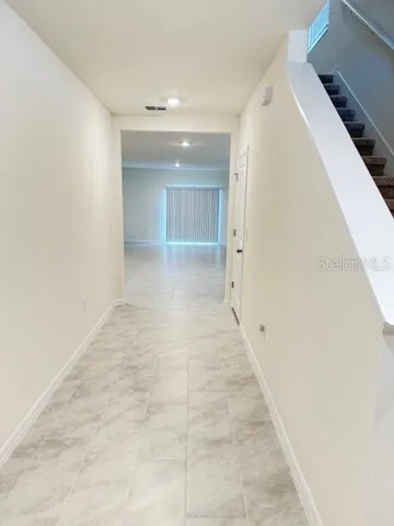 a view of hallway with stairs