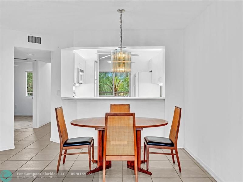 9551 Weldon Circle, Unit E311 Tamarac, FL 33321 - Photo 16 of 64 a view of dining room with furniture and window