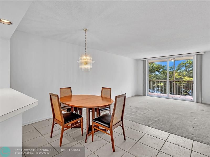 9551 Weldon Circle, Unit E311 Tamarac, FL 33321 - Photo 17 of 64 a view of a dining room with furniture window and outside view
