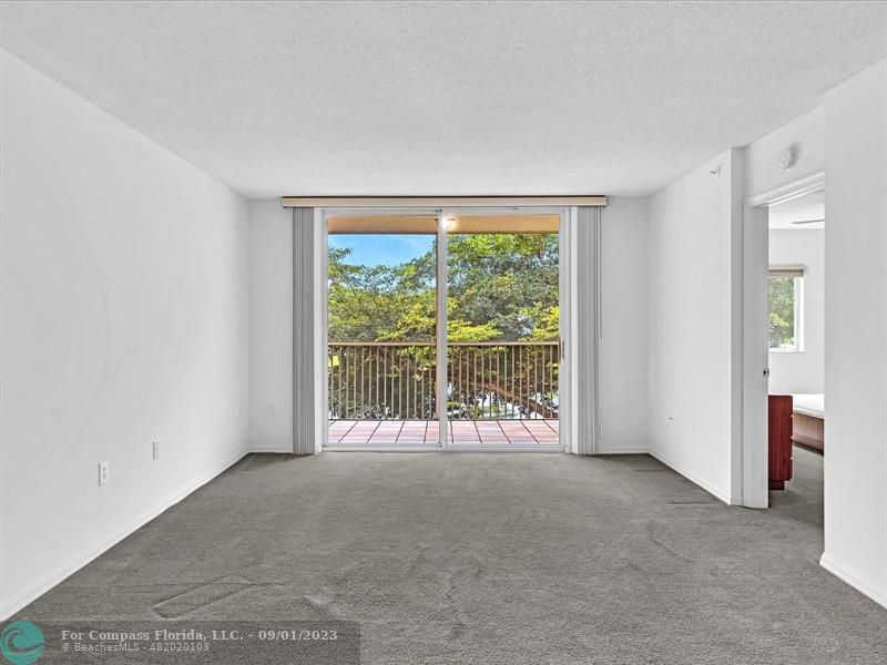 9551 Weldon Circle, Unit E311 Tamarac, FL 33321 - Photo 18 of 64 a view of an empty room with a window