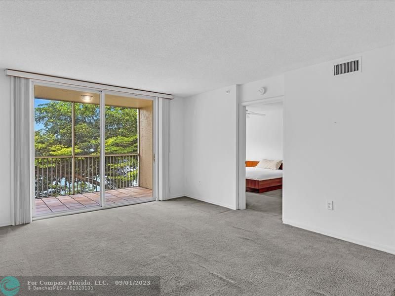9551 Weldon Circle, Unit E311 Tamarac, FL 33321 - Photo 22 of 64 a view of an empty room with a window