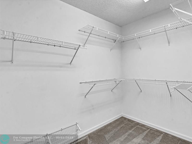 9551 Weldon Circle, Unit E311 Tamarac, FL 33321 - Photo 28 of 64 a view of a room with racks on the wall