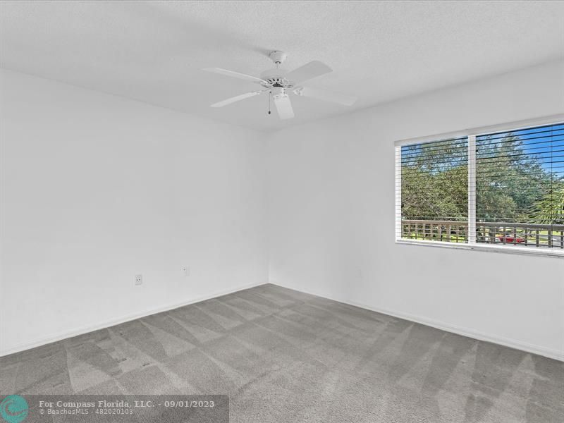 9551 Weldon Circle, Unit E311 Tamarac, FL 33321 - Photo 29 of 64 an empty room with a window
