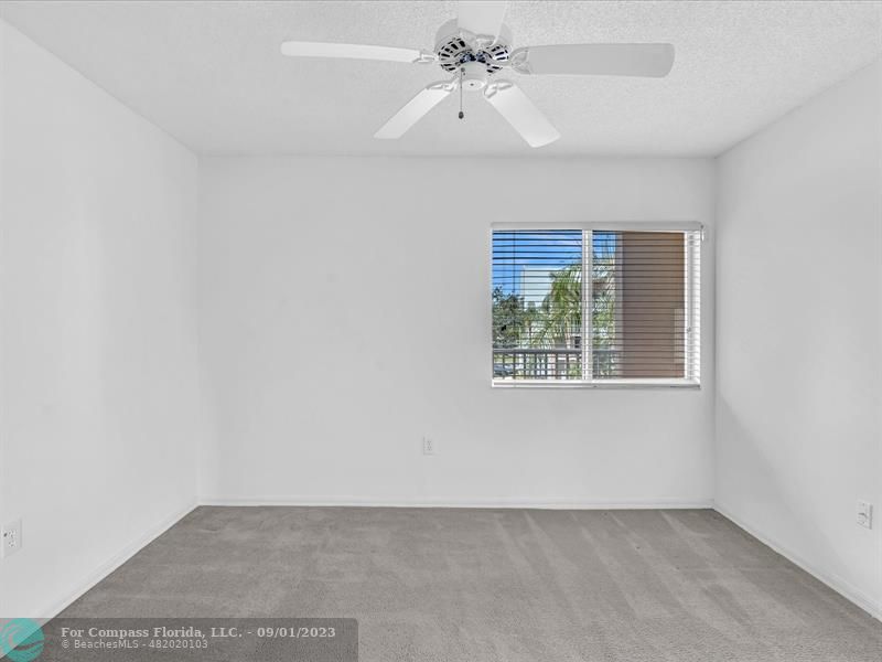 9551 Weldon Circle, Unit E311 Tamarac, FL 33321 - Photo 31 of 64 a view of an empty room with a window