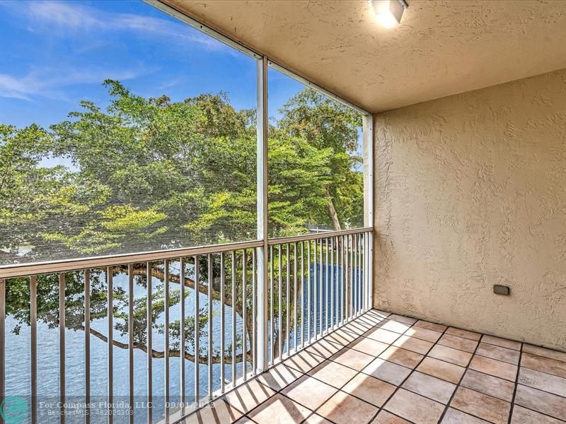9551 Weldon Circle, Unit E311 Tamarac, FL 33321 - Photo 36 of 64 a view of a balcony with an outdoor space