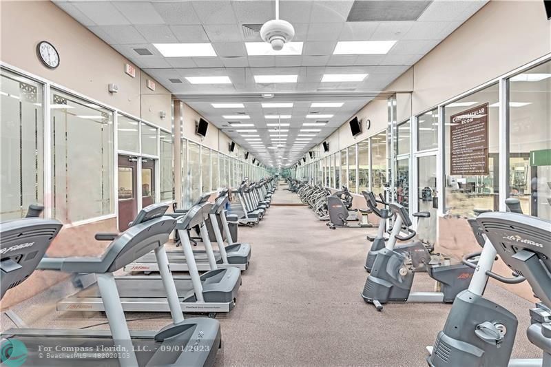 9551 Weldon Circle, Unit E311 Tamarac, FL 33321 - Photo 56 of 64 a view of a room with gym equipment