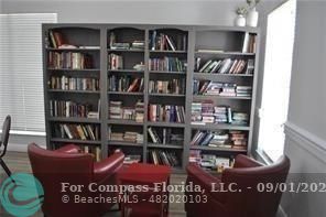 9551 Weldon Circle, Unit E311 Tamarac, FL 33321 - Photo 59 of 64 a view of a book shelf with books on shelf