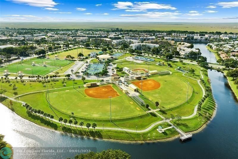 9551 Weldon Circle, Unit E311 Tamarac, FL 33321 - Photo 63 of 64 an aerial view of a swimming pool
