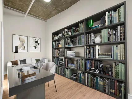 a view of a workspace with bookshelf