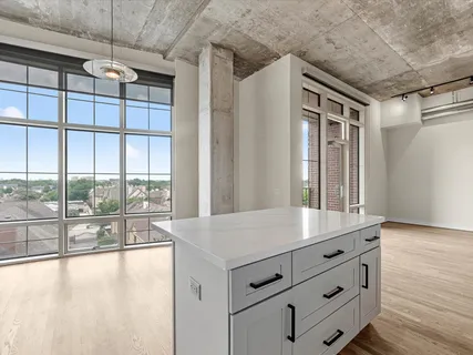 a view of room with window and wooden floor